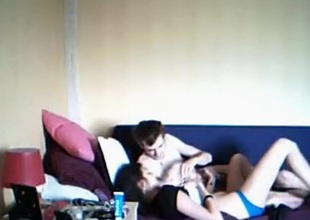 Girl does the naughty with her boyfriend on the sofa